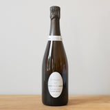 Laurent Bénard Vibratis 2013 Champagne bottle on a wooden table