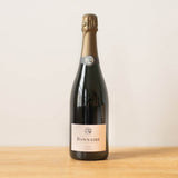 Bonnaire Rosé Assemblage Champagne bottle on a wooden table