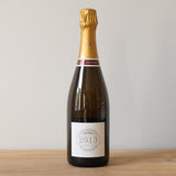 Legras & Haas Les Sillons 2013 Champagne bottle on a wooden table